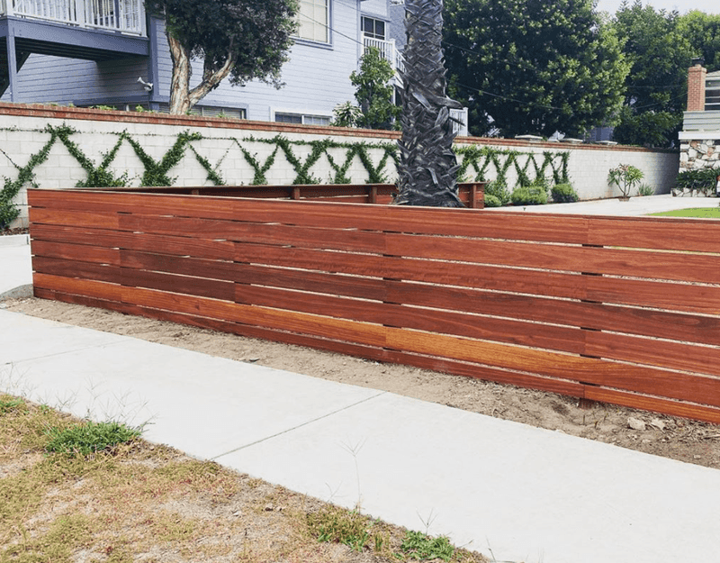12 Coastal-Inspired Curb Appeal Ideas Seen In California Homes (And 3 That Are Losing Charm Fast) - Decor Hint Horizontal Slatted Fencing