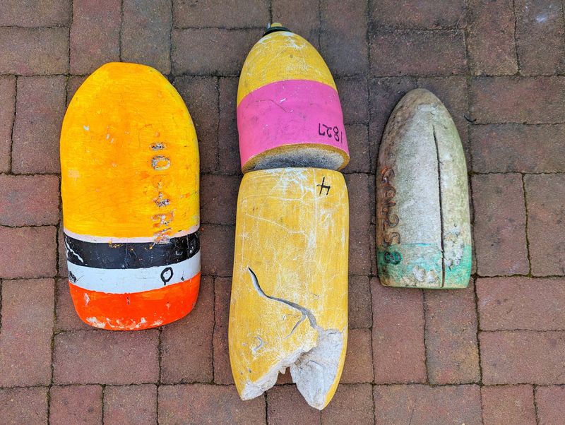 Antique Buoys With Faded Paint