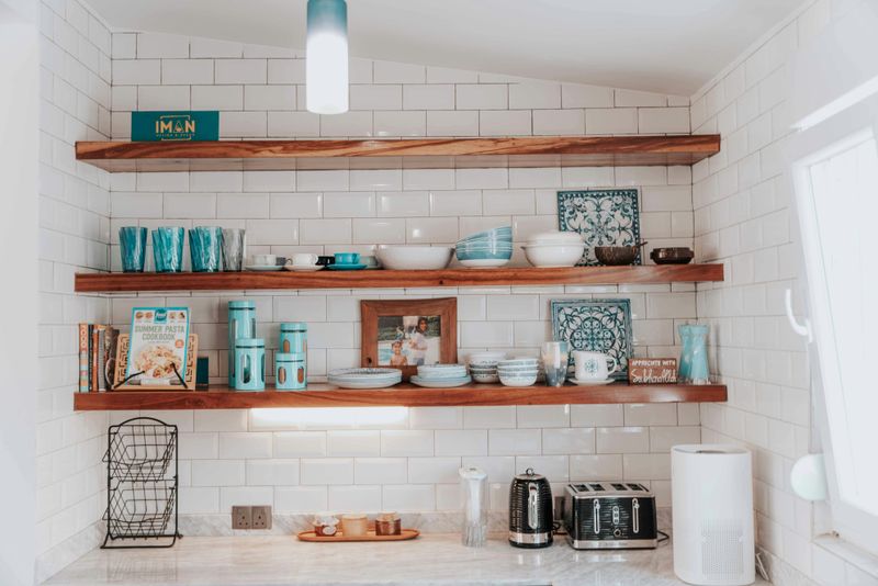 8 Home Decor Trends That Are Quickly Falling Out Of Style - Decor Hint Open Shelving Overload