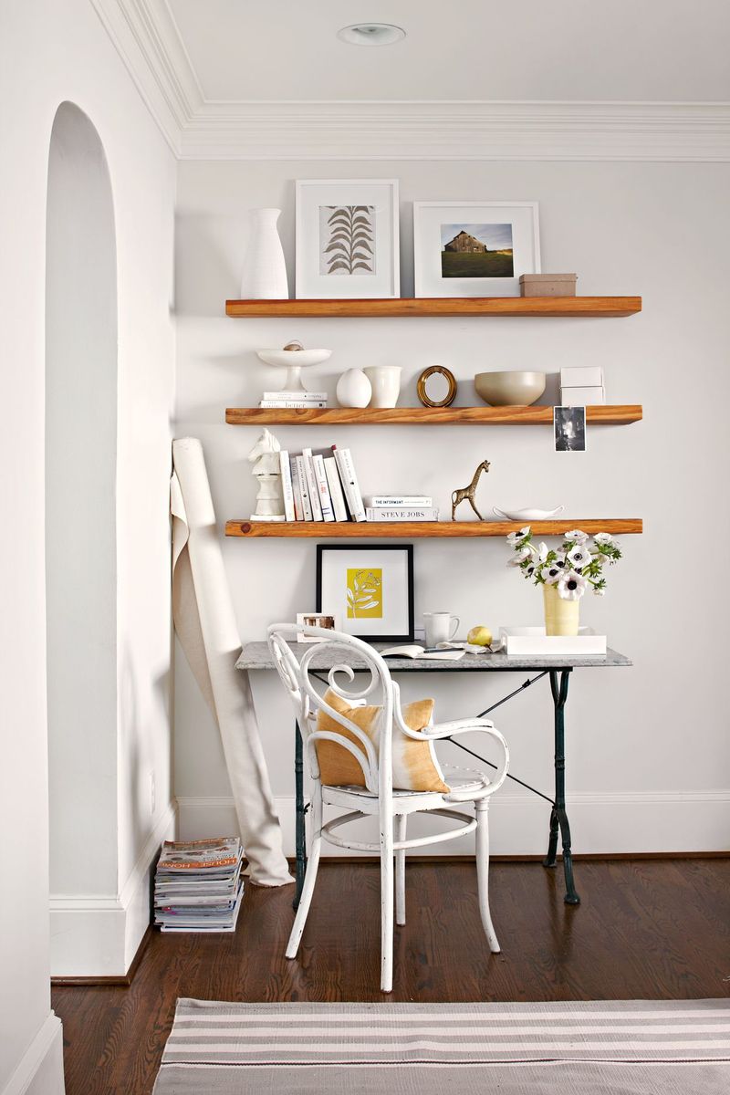 The Underrated Trick Designers Use To Maximize Tiny Living Areas - Decor Hint Floating Shelves