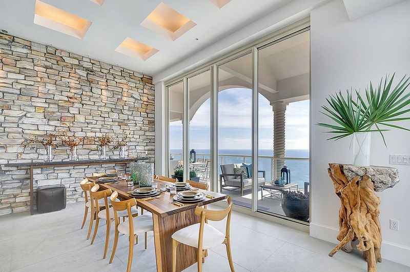 14 Mediterranean-Inspired Living Spaces That Bring A European Getaway Home - Decor Hint Space Accented With Natural Stone Walls