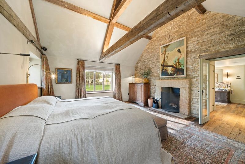 Primary Suite Offers A Spa-Like Escape With Soaring Ceilings And Garden Vistas