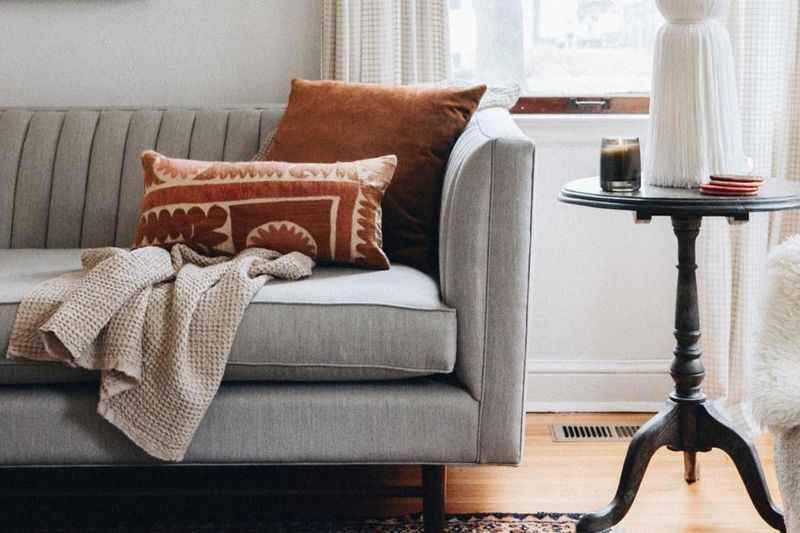 16 Things You Should Always Buy For Your Home, According To Interior Designers (Plus 5 Secret Gems) - Decor Hint Throw Pillows and Blankets