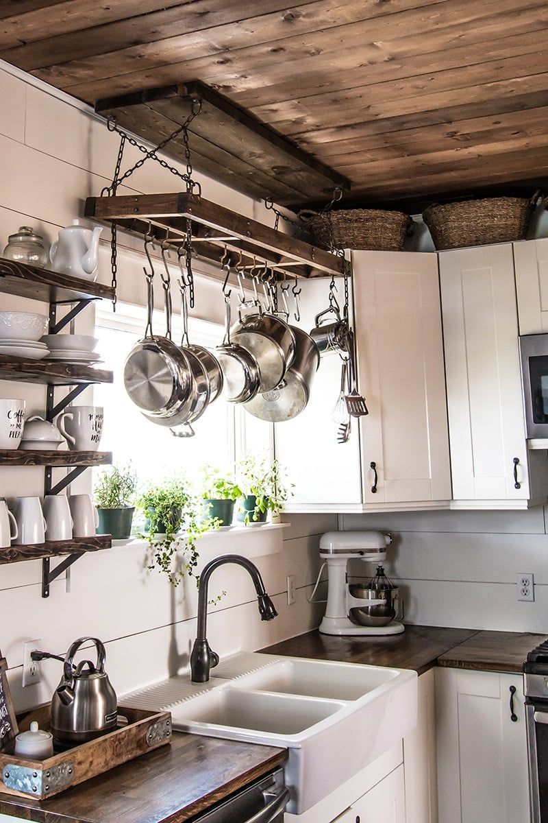 11 Simple Changes That Make A Small Kitchen Feel Spacious - Decor Hint Hang Pots Vertically