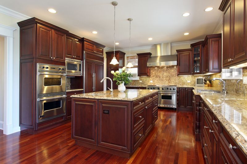 4 Home Features Naples Buyers Are Quietly Passing Over Lately (And 4 They Have Always Avoided) - Decor Hint Dark Wood Cabinetry