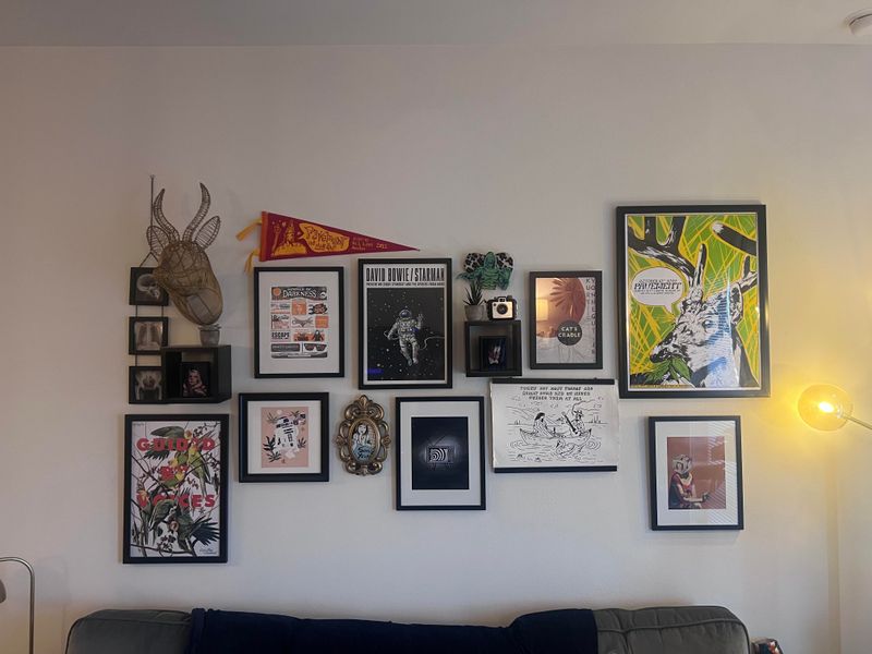 22 Things That Make Your Home Look Cheap - Decor Hint Haphazard Wall Art Arrangement