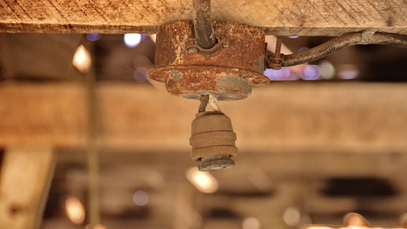 7 Porch Pieces To Toss And 5 That Designers Recommend Keeping - Decor Hint Toss: Broken or Rusty Light Fixtures