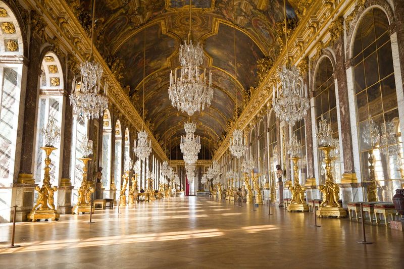 18 Photos That Show Inside A Mansion That Belonged To One Of America’s Wealthiest Families - Decor Hint Ornate Chandelier Hanging in a Vaulted Ballroom
