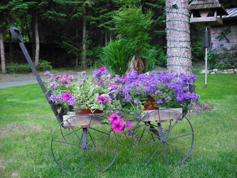Charming Outdoor Corners That Give Georgia Homes Their Magic - Decor Hint Antique Wheelbarrows Repurposed as Flower Planters