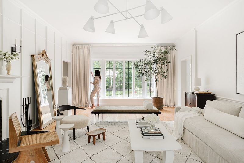 11 Game-Changing Decorating Tips From Our Editors' Favorites - Decor Hint Hang Curtains High and Wide for Bigger Windows