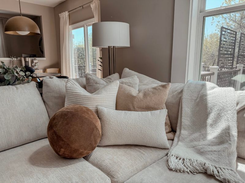 21 Clever Ways To Update Your Living Room Without Replacing The Furniture - Decor Hint Drape Throws Strategically