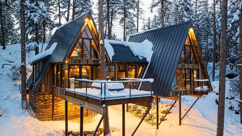 10 Modern Treehouse-Style Homes Made For Relaxing Above It All - Decor Hint Alpine A-Frame Among Aspen Trees