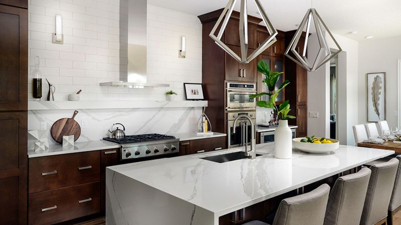 10 Earth-Toned Kitchens That Strike The Perfect Balance Between Modern & Timeless (Plus 10 That Are A Bad Choice) - Decor Hint Rich Brown Wood Cabinets Balanced With Light Quartz