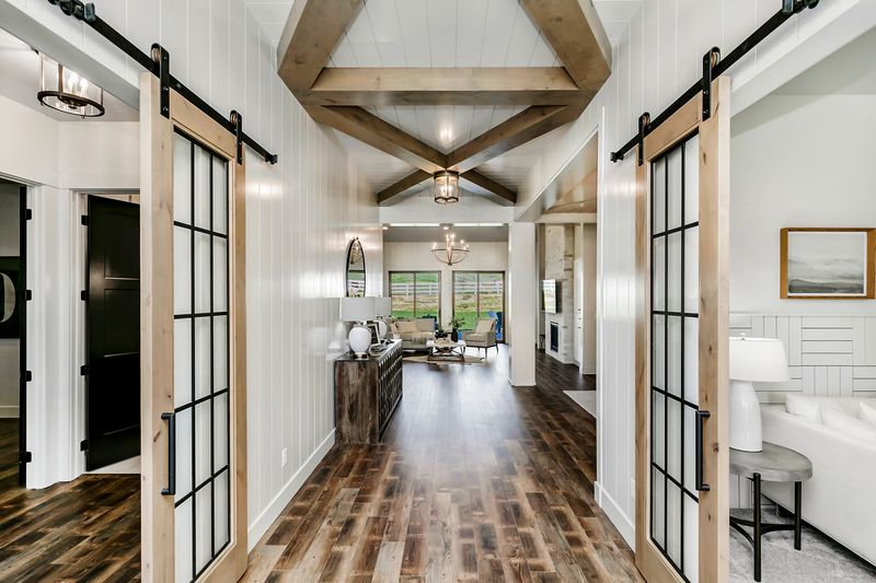 22 Fancy Barndominium Homes That Beautifully Mix Rustic With Modern - Decor Hint Sliding Barn-Style Glass Partitions