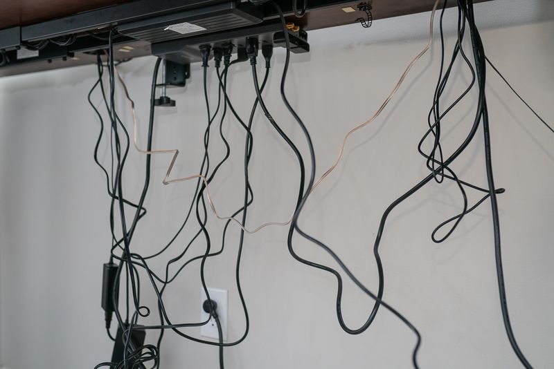 Designer Secrets: 8 Items You Should Absolutely Avoid Displaying On Your Living Room Shelves - Decor Hint Visible Electronics And Cords