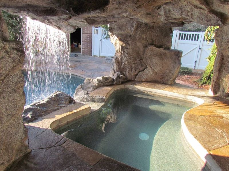 37 Stylish Poolside Designs That Make Everyday Feel Like Vacation - Decor Hint Swim-Through Grottos With Hidden Seating