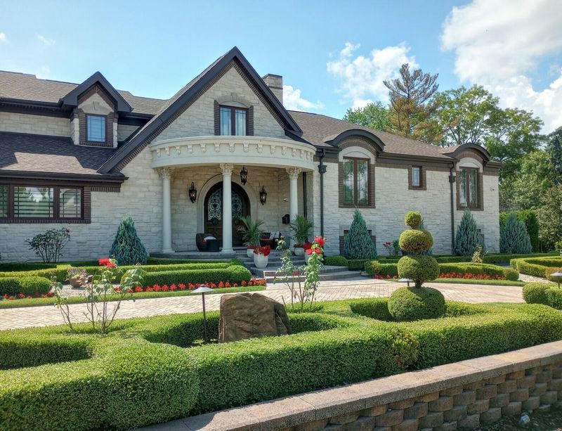 8 Curb Appeal Classics Michigan Homeowners Can't Stop Showing Off - Decor Hint Symmetrical Landscaping That Frames Houses Perfectly
