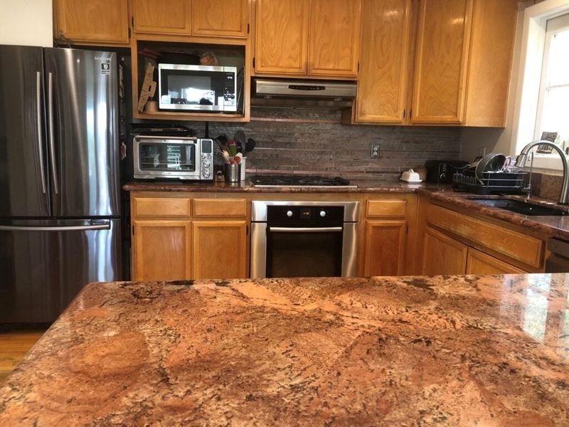 Why Some Georgia Homes Are Already Feeling Outdated, 12 Styles On Their Way Out By 2030 - Decor Hint Builder-Grade Oak Cabinets
