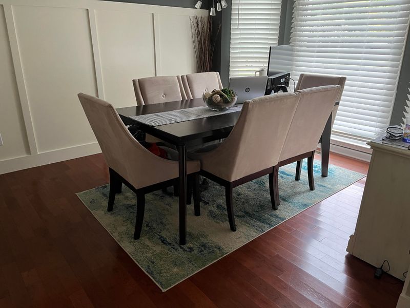 20 Dining Room Features That Are Always Eyesores, According To Experts - Decor Hint Too-Small Area Rugs