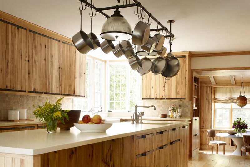 7 Outdated Kitchen Trends Losing Steam In New York Homes (Plus 8 That Endure) - Decor Hint Pot Racks Hanging Over Islands