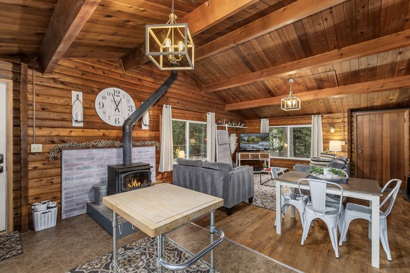 12 Cozy Washington Cabin Touches That Take You Back - Decor Hint Stacked Firewood as Decor