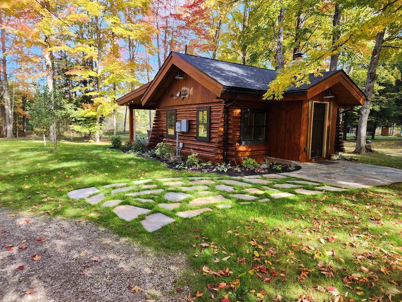 These 9 Woodsy Cabin Aesthetics From Michigan Retreats Will Inspire Your Exterior - Decor Hint Pathways Of Native Stone That Guide Through Wilderness