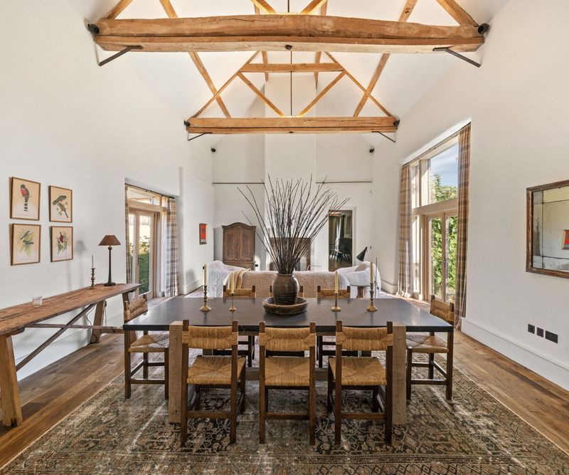 Charming Dining Room Anchored By Antique Details And Inviting Views