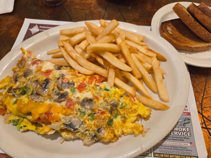 Omelets so big they barely fit the plate