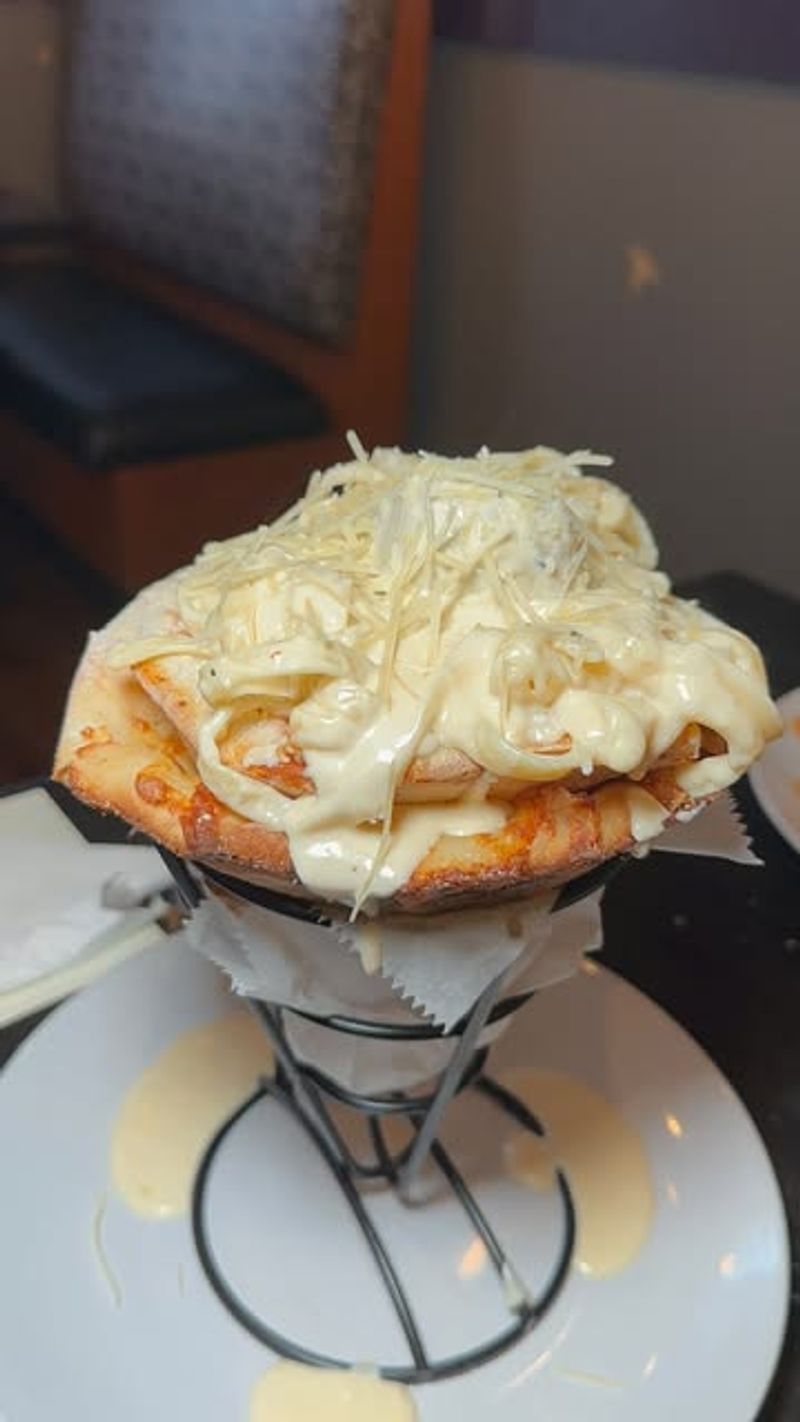 The Mount Vesuvius Pizza Cone Is Peak Comfort Food Chaos
