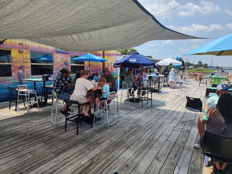 Waterfront Deck Seating Where Shrimp Boats Become Dinner Theater