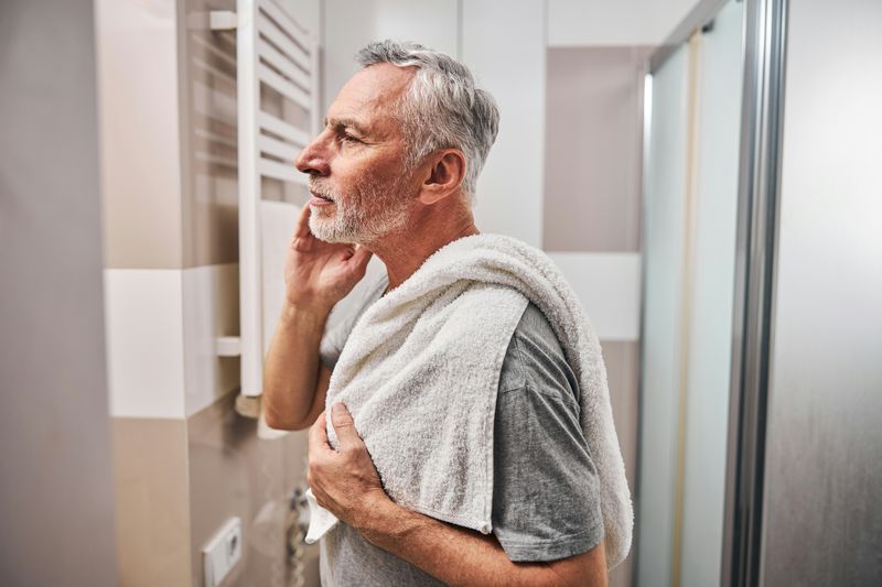 Poor Grooming and Hygiene https://unsplash.com/photos/side-view-photo-of-a-serious-aged-man-looking-in-the-mirror-while-standing-in-the-bathroom-with-a-towel-iGx-6vJmMSA