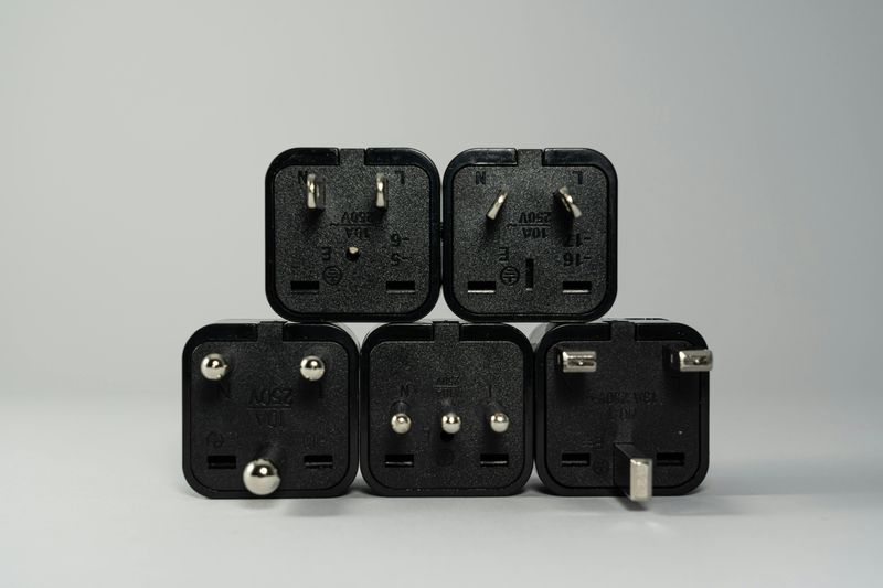 Wall plug + international adapter (if flying)