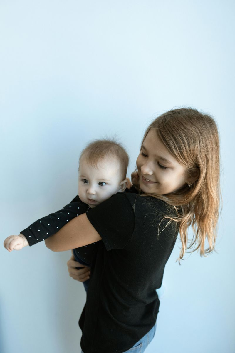 Taking care of younger siblings (or babysitting) way earlier