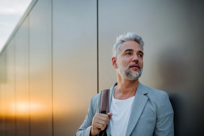 Acting Superior or Condescending https://unsplash.com/photos/a-mature-relaxed-businessman-leaning-on-street-wall-work-life-balance-concept-6_cVAe4BEIY