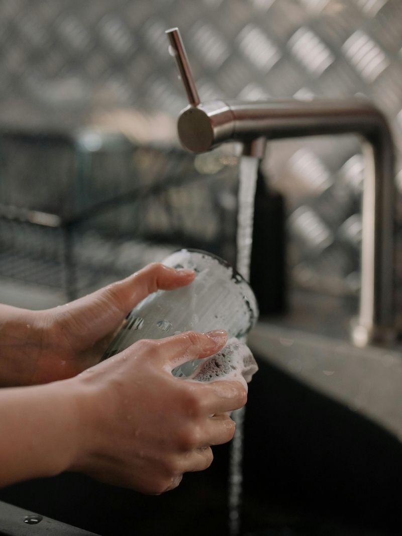Hand-washing dishes before the dishwasher