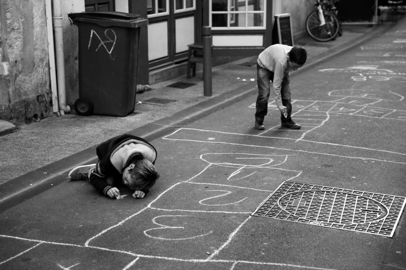 Drawing Hopscotch or Chalk Cities on the Driveway