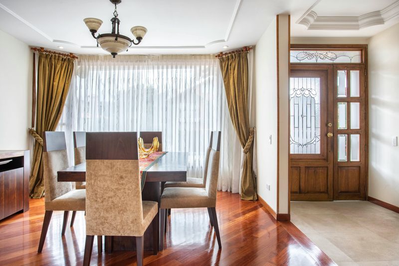 Add floor-to-ceiling curtains (even if the windows aren’t)