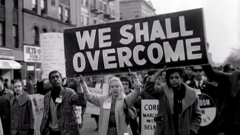 “We Shall Overcome” – Various Artists (Traditional)