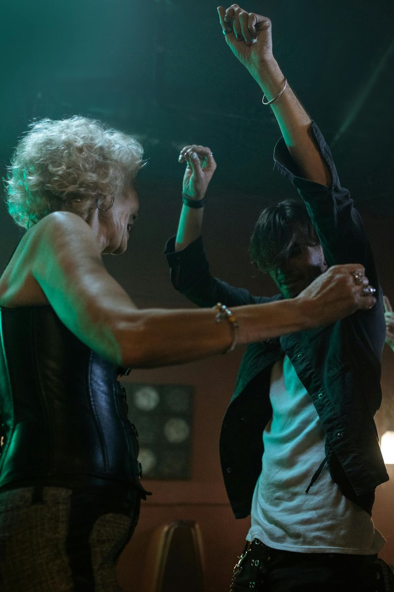 Clubbing amid crowds and deafening music.