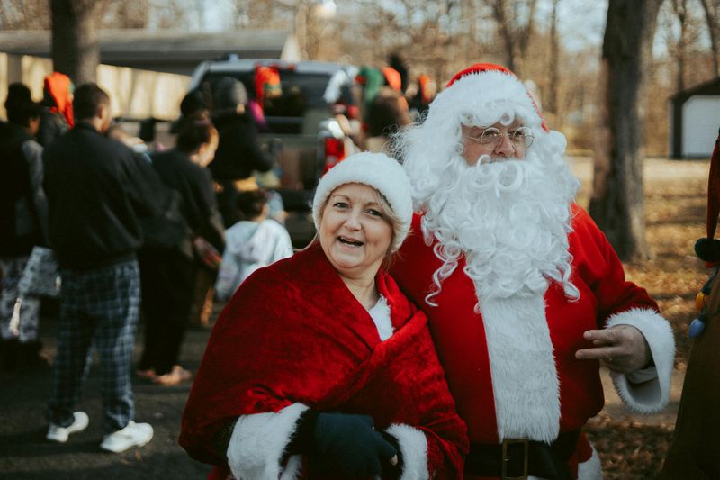 Carollers Holding Buckets for Charity