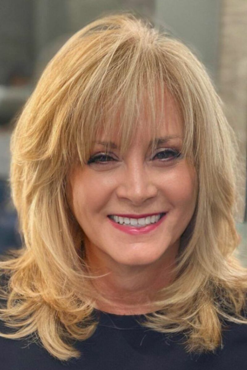 Heavy Bangs That Overwhelm the Forehead