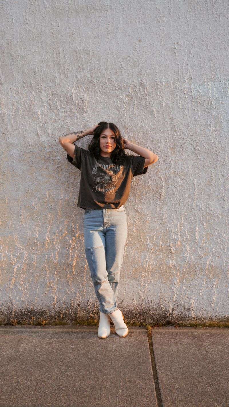 High-Waisted Acid Wash Jeans with a Graphic Tee