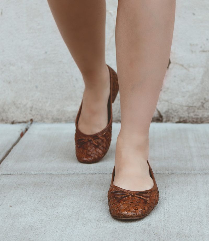 Worn-Out Ballet Flats with Bow Detailing